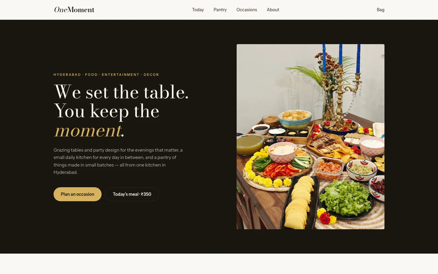 The One Moment store home page: a grazing-table spread beside the day's meal and its price.
